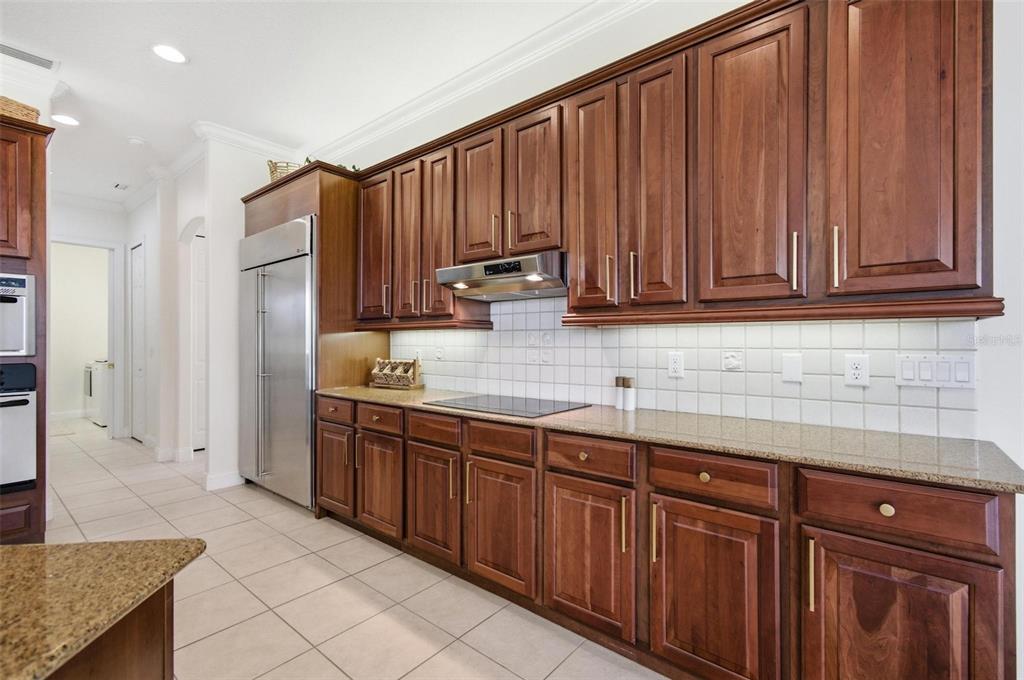 83 Front Street Palm Coast, FL 32137 - Photo 25 of 100 a kitchen with stainless steel appliances granite countertop a refrigerator and cabinets