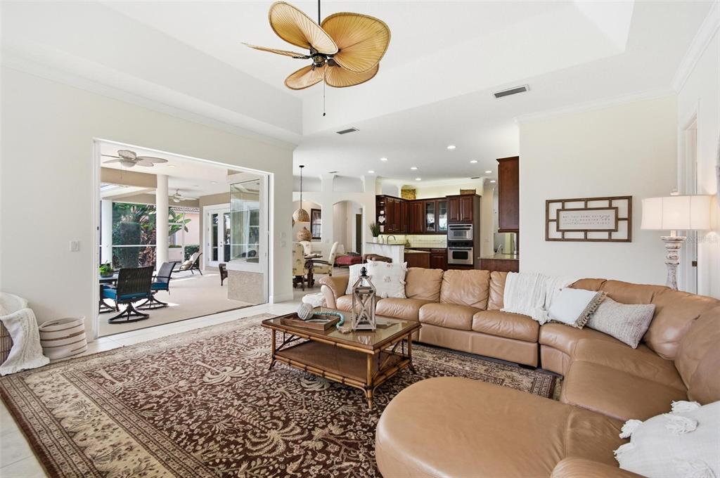83 Front Street Palm Coast, FL 32137 - Photo 32 of 100 a living room with furniture kitchen view and a rug