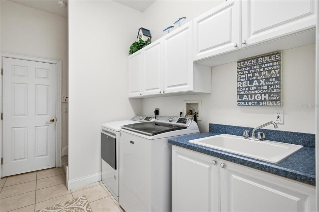 83 Front Street Palm Coast, FL 32137 - Photo 36 of 100 a kitchen with stainless steel appliances granite countertop a sink stove and cabinets