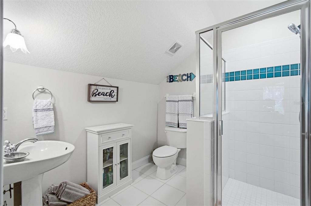 83 Front Street Palm Coast, FL 32137 - Photo 40 of 100 a bathroom with a toilet sink and shower