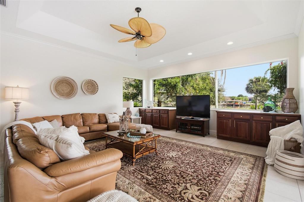 83 Front Street Palm Coast, FL 32137 - Photo 4 of 100 a living room with furniture and a flat screen tv