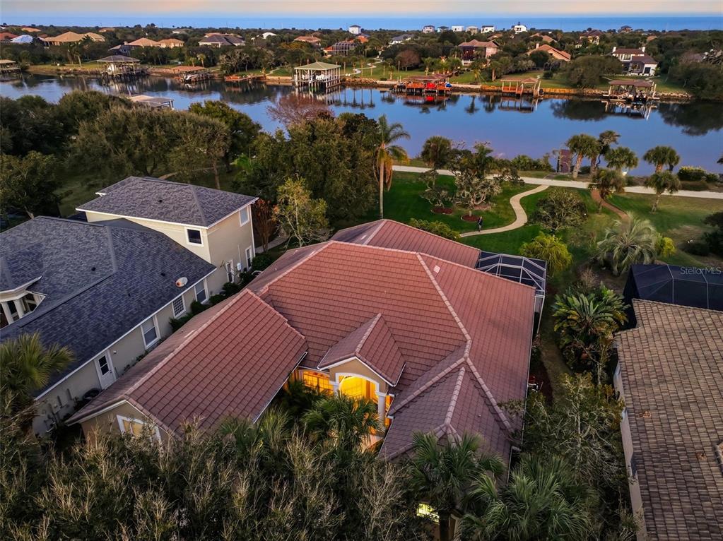 83 Front Street Palm Coast, FL 32137 - Photo 77 of 100 an aerial view of a house with outdoor space and lake view