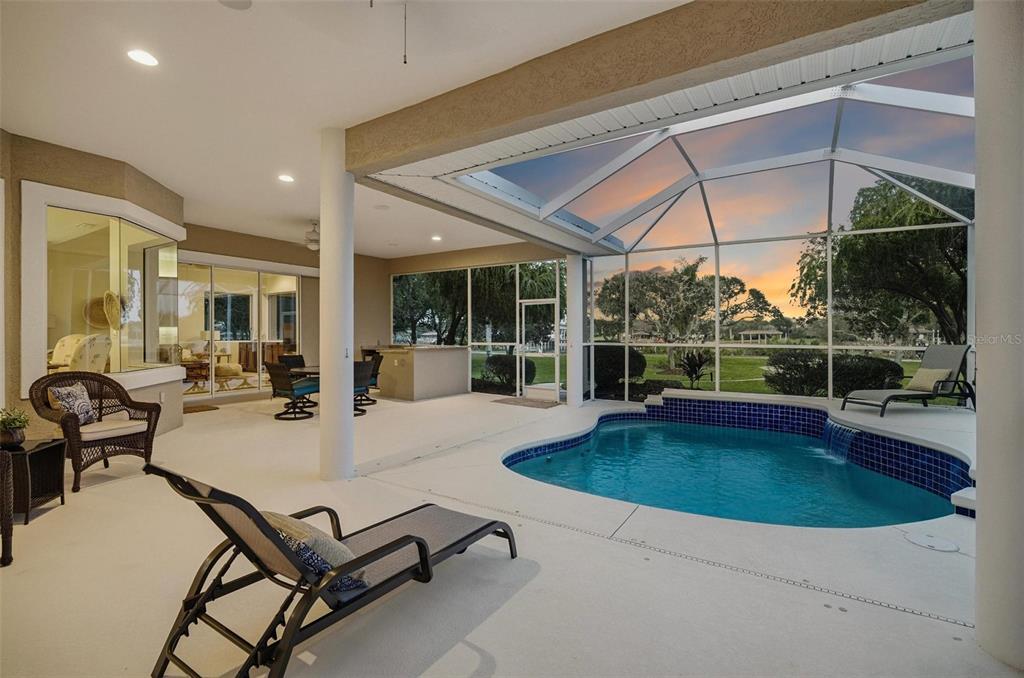 83 Front Street Palm Coast, FL 32137 - Photo 78 of 100 a view of a patio with swimming pool table and chairs