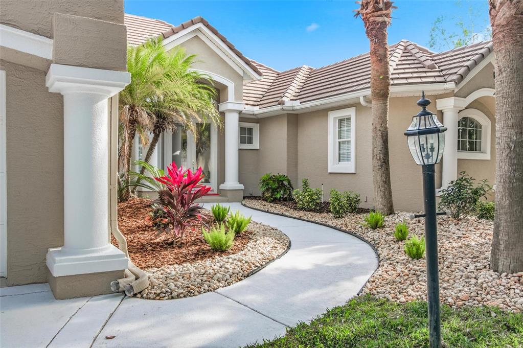 83 Front Street Palm Coast, FL 32137 - Photo 8 of 100 a front view of a house with a porch