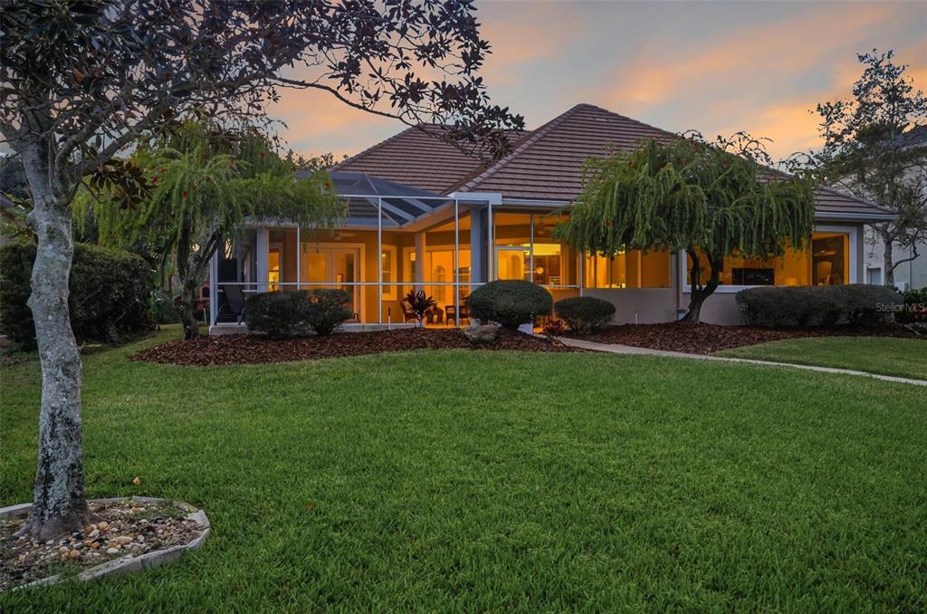83 Front Street Palm Coast, FL 32137 - Photo 81 of 100 a front view of house with yard and green space