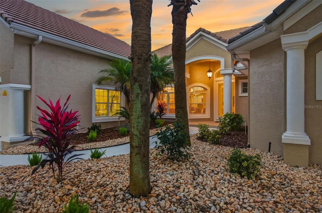 83 Front Street Palm Coast, FL 32137 - Photo 85 of 100 a front view of a house with a yard