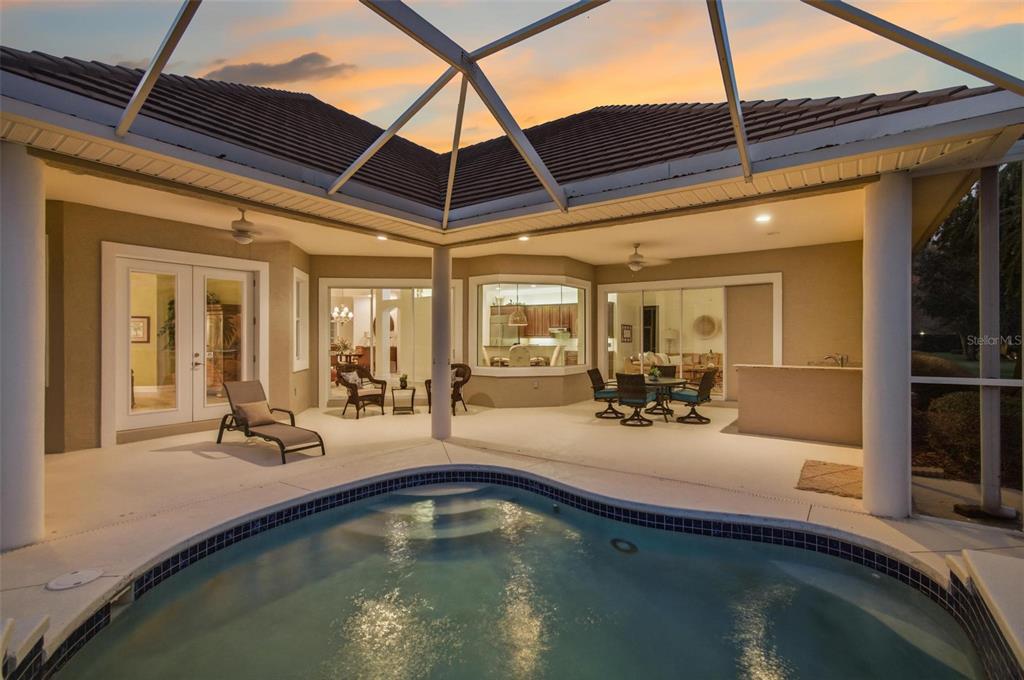 83 Front Street Palm Coast, FL 32137 - Photo 89 of 100 a view of a swimming pool with a patio