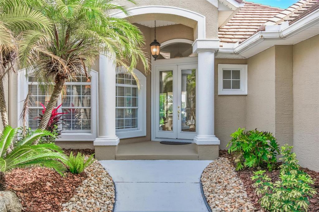83 Front Street Palm Coast, FL 32137 - Photo 9 of 100 a front view of a house with a yard