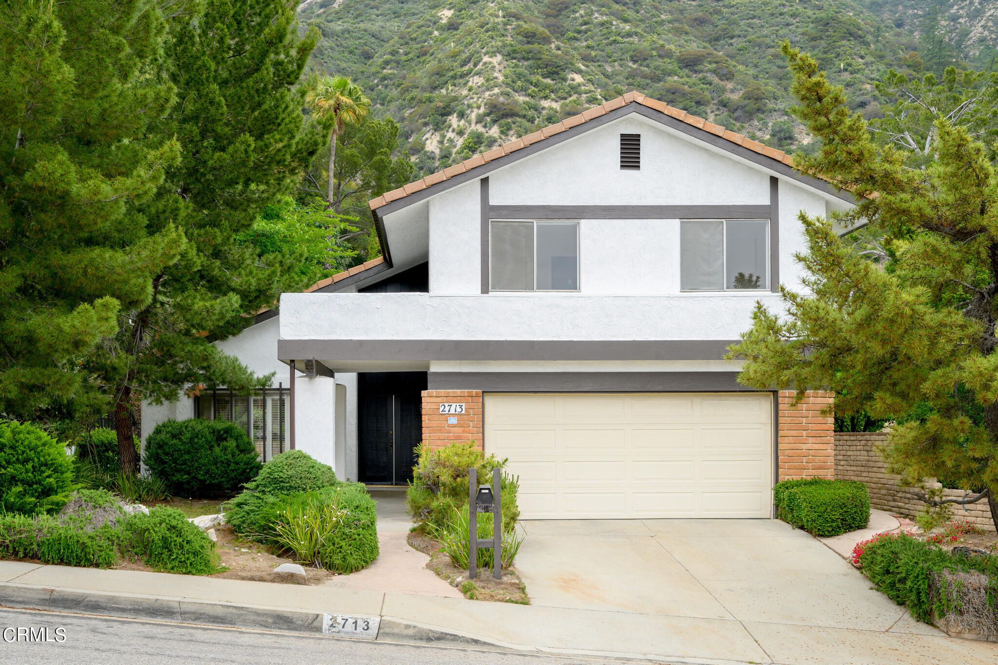 2713 Starfall Drive La Crescenta, CA 91214 - Photo 1 of 37 a front view of a house with garden