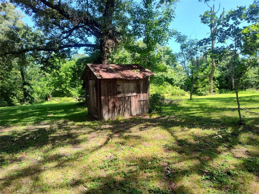 3961 Counts Road Point Blank, TX 77364 - Photo 4 of 9 a view of a tiny house with a yard