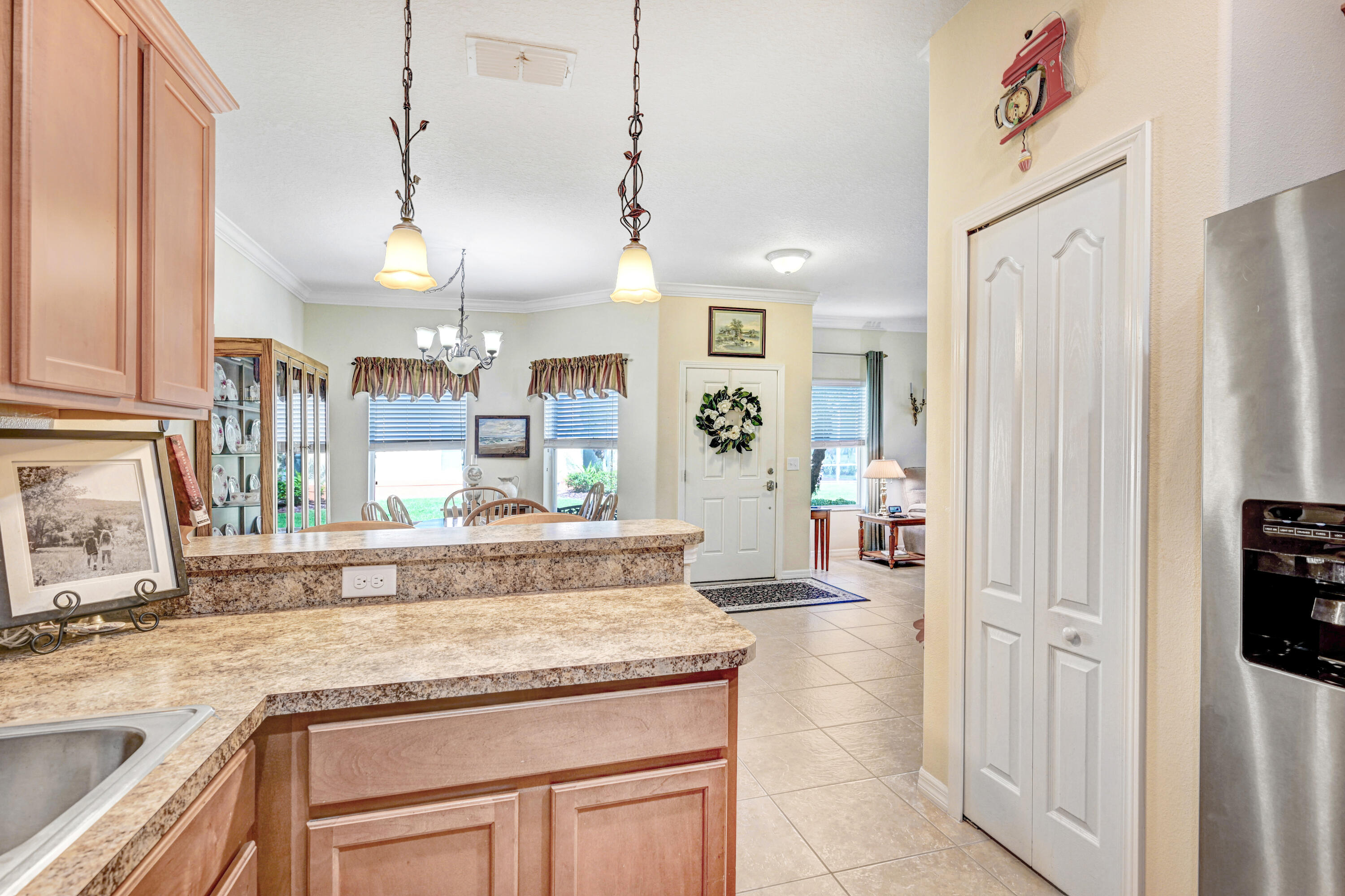 3600 Funston Circle Melbourne, FL 32940 - Photo 18 of 48 a kitchen with stainless steel appliances granite countertop a refrigerator and a sink