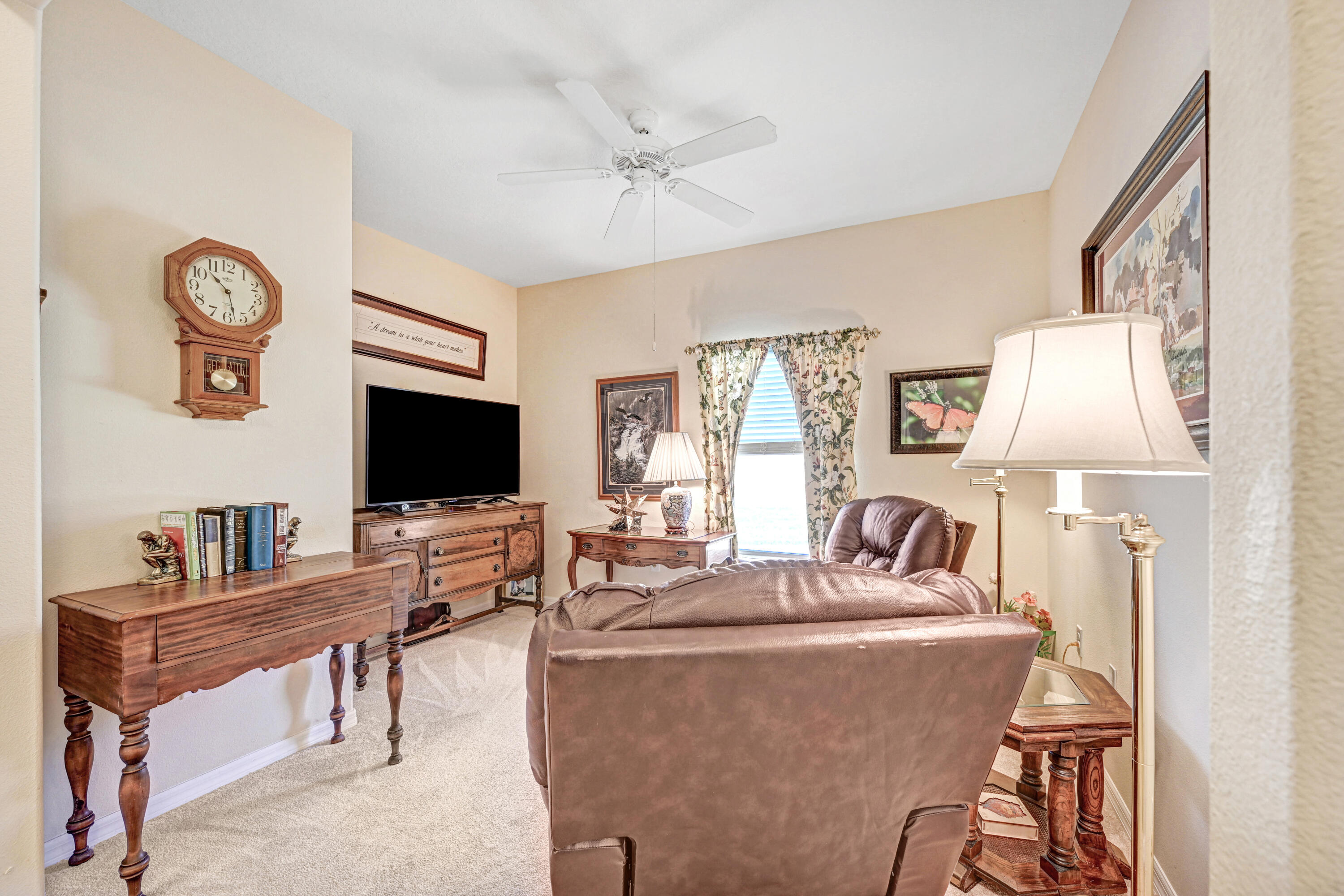 3600 Funston Circle Melbourne, FL 32940 - Photo 26 of 48 a living room with furniture a flat screen tv and a table