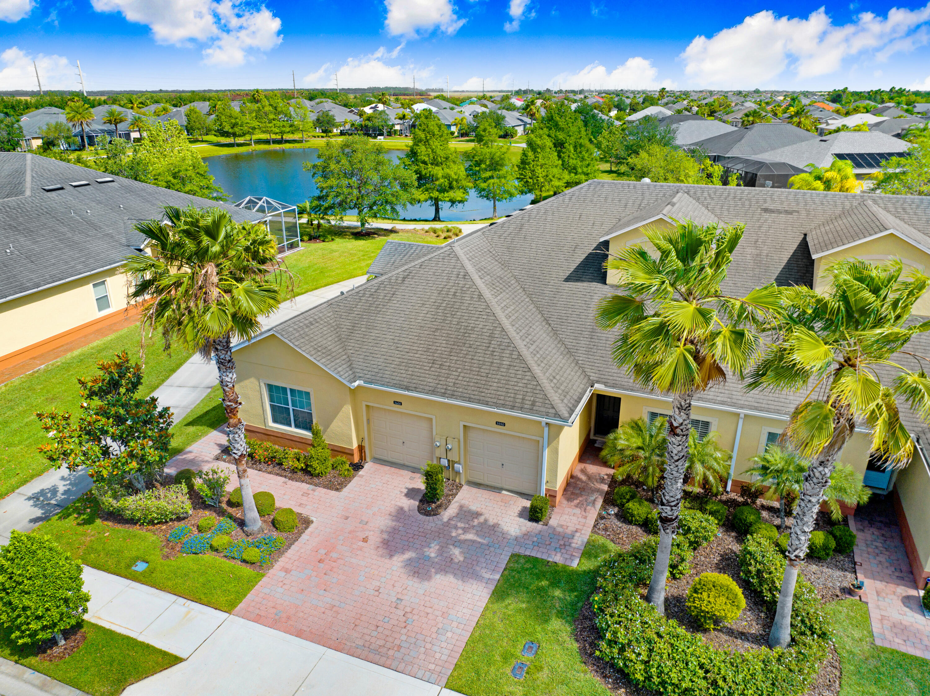 3600 Funston Circle Melbourne, FL 32940 - Photo 45 of 48 an aerial view of a house with a garden and lake view
