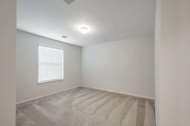 a bathroom with a bathtub shower sink vanity and toilet