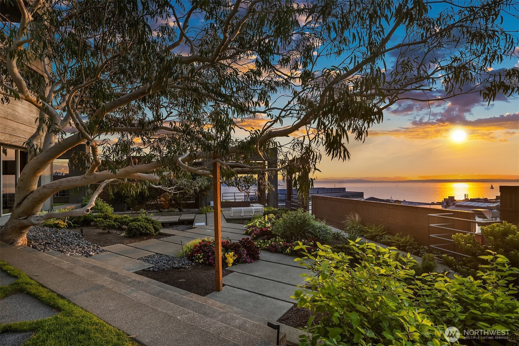 2125 1st Avenue, Unit 1205 Seattle, WA 98121 - Photo 14 of 19 a view of a street with a bench and trees