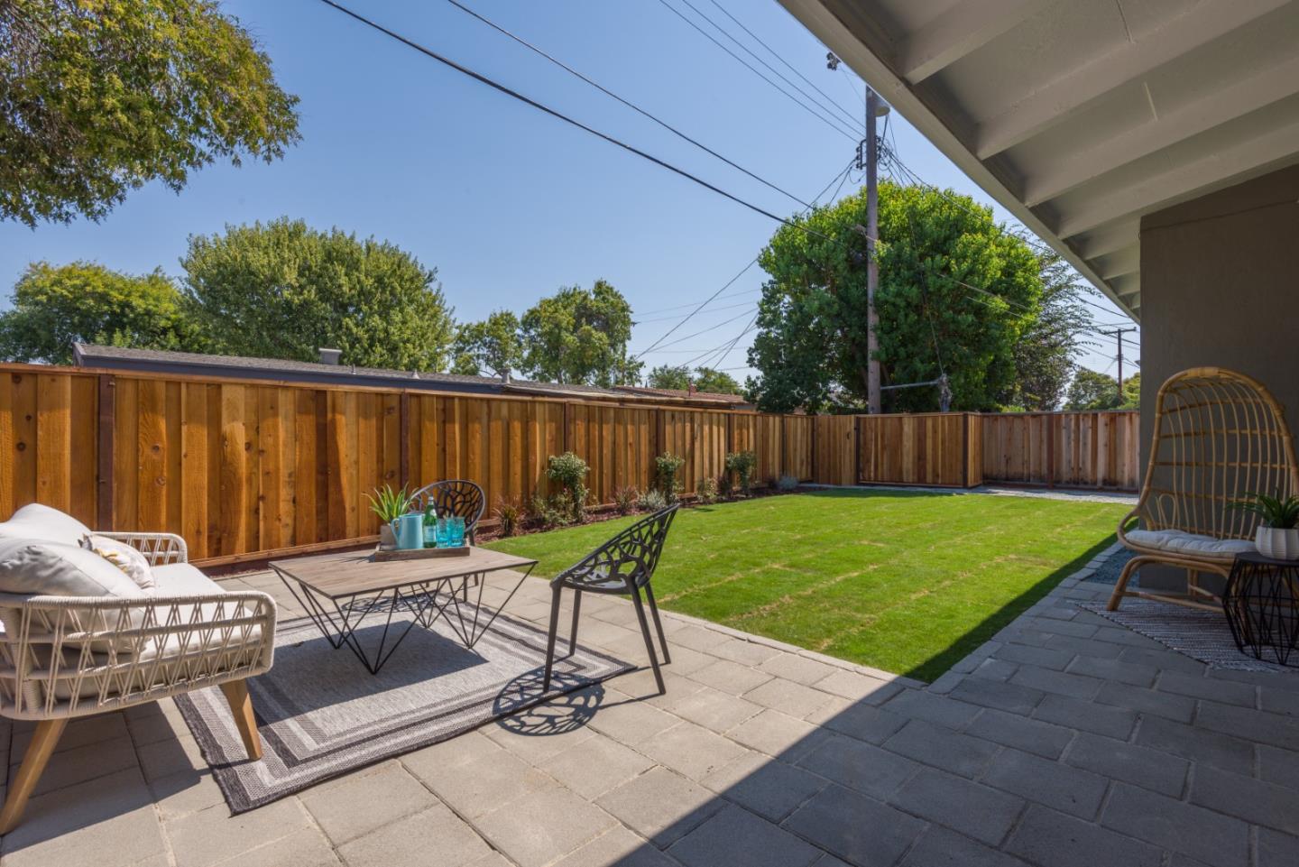 1765 Ravizza Avenue Santa Clara, CA 95051 - Photo 11 of 14 a view of backyard with seating space and trees