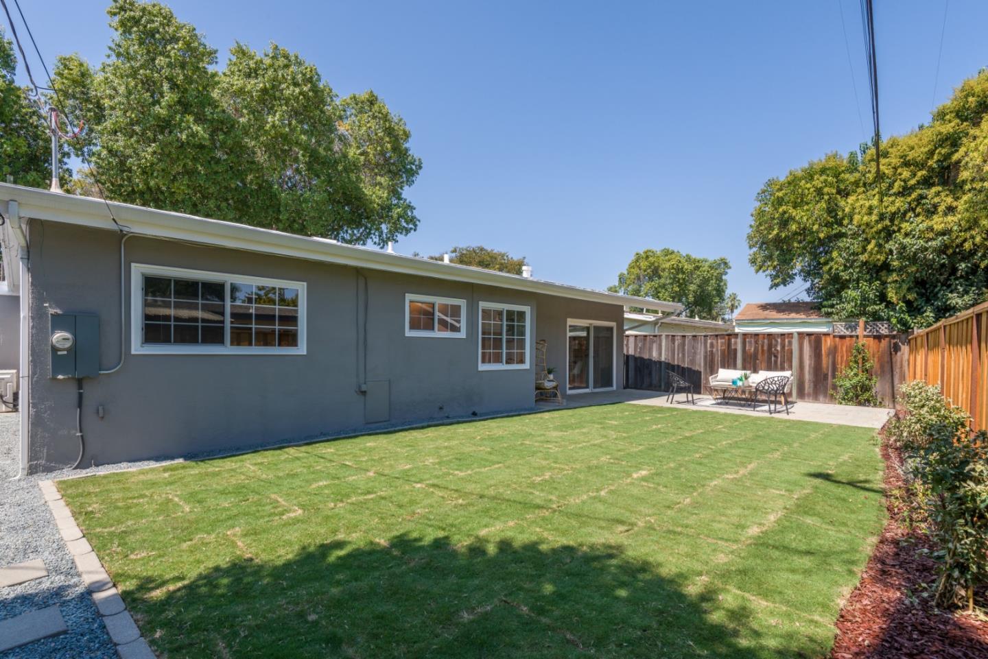 1765 Ravizza Avenue Santa Clara, CA 95051 - Photo 12 of 14 a backyard of a house with table and chairs