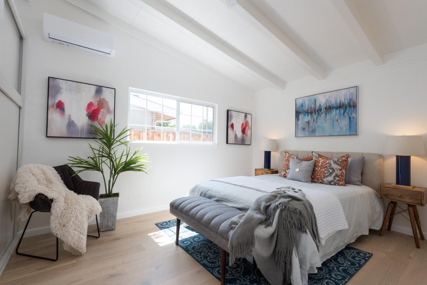 1765 Ravizza Avenue Santa Clara, CA 95051 - Photo 6 of 14 a bedroom with a large bed and a painting on the wall