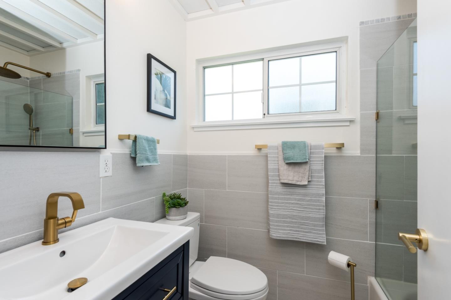 1765 Ravizza Avenue Santa Clara, CA 95051 - Photo 7 of 14 a bathroom with a sink a toilet and shower