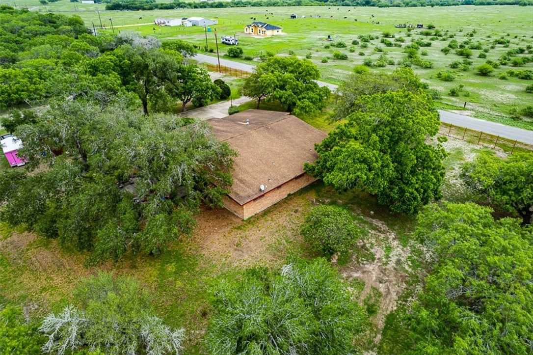 9675 County Road 325 Mathis, TX 78368 - Photo 27 of 29 a view of a garden with a building