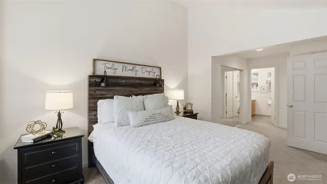 a bedroom with a bed and dresser