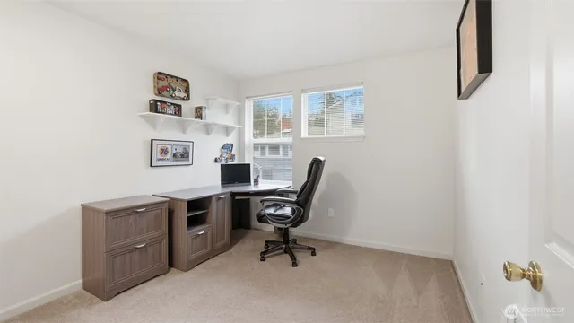a view of a workspace with furniture