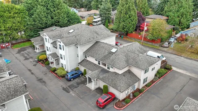 an aerial view of a house with a yard and garden