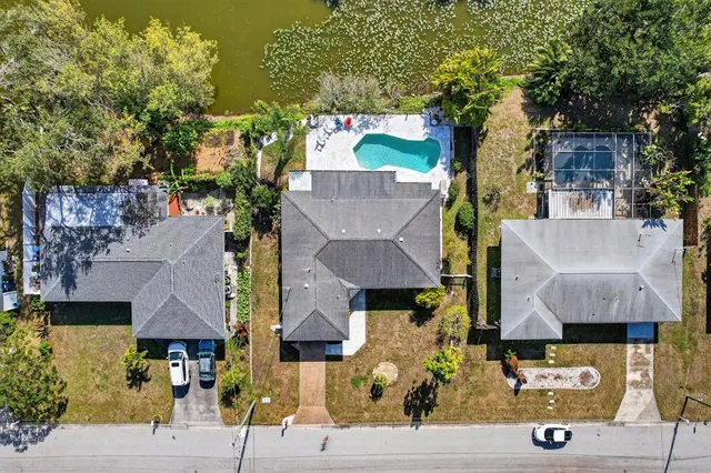 an aerial view of houses with outdoor space