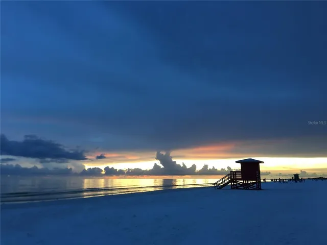 a view of empty room with window and fireplace