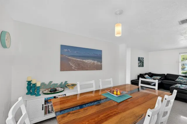 a living room with furniture and flat screen tv