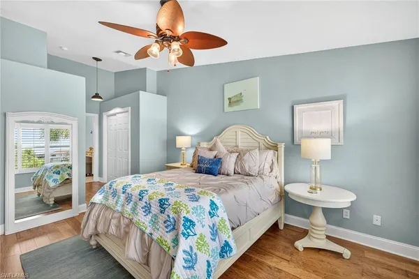 a bedroom with a bed and a lamp
