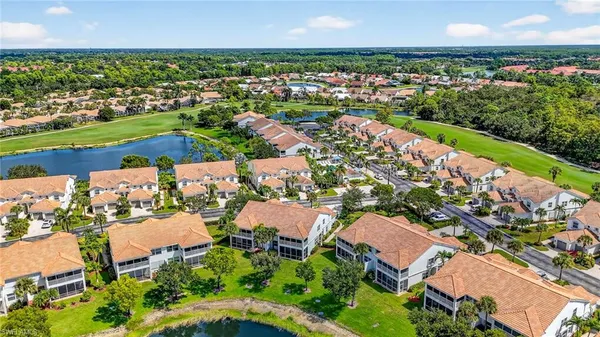 an aerial view of a houses and an outdoor space