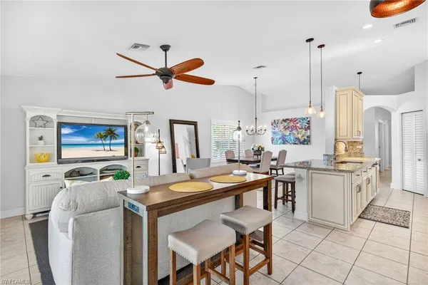 a kitchen that has a table and chairs in it