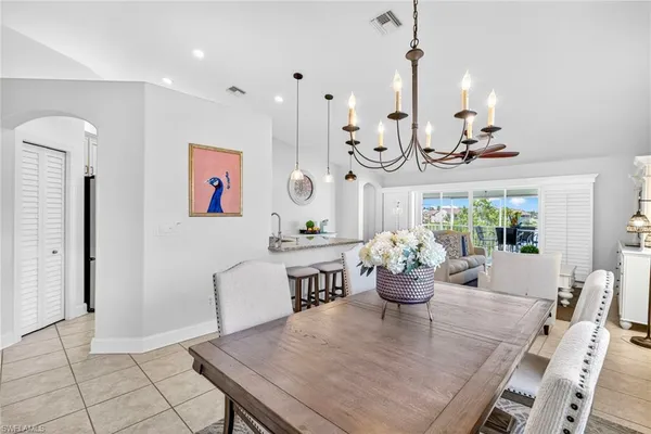a dining room with furniture and window