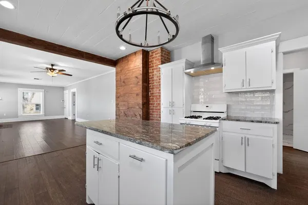 a kitchen with a sink cabinets and window