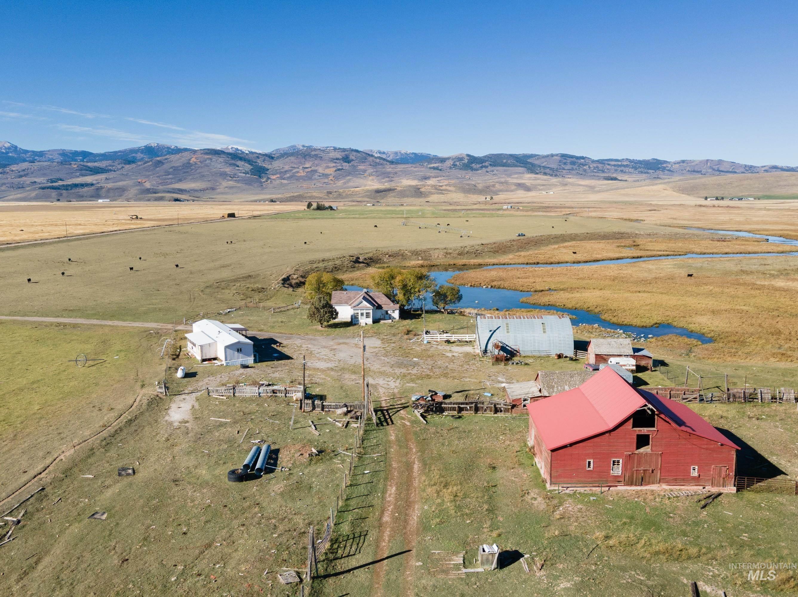 986 Rocky Ford Road Bancroft, ID 83217 - Photo 2 of 5 View of rural area featuring a pastoral area and a mountain backdrop