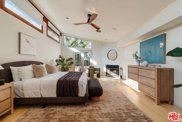 a view of a house with a backyard and garden