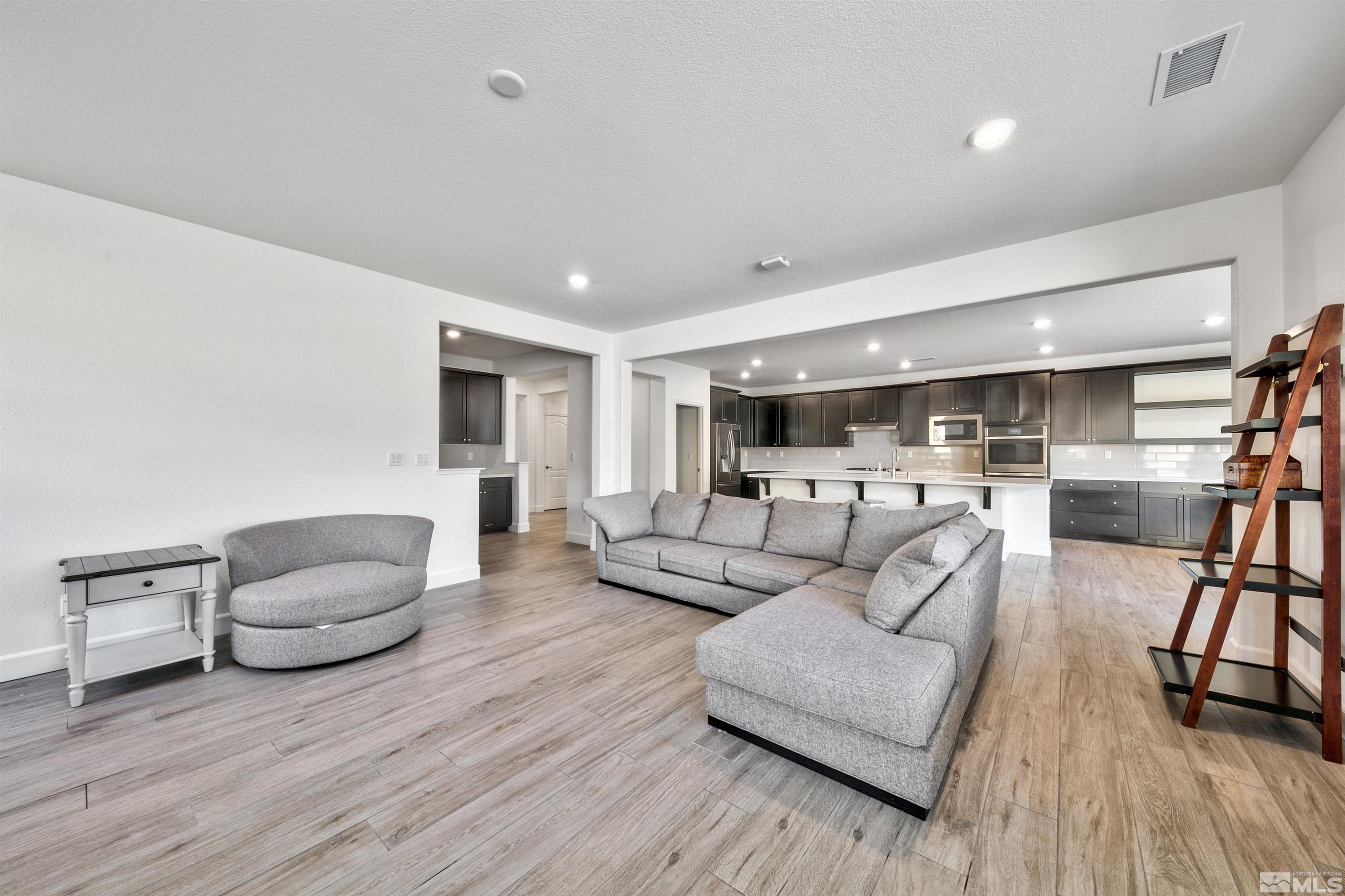 4505 High Pointe Drive Reno, NV 89521 - Photo 12 of 30 a living room with furniture and a wooden floor