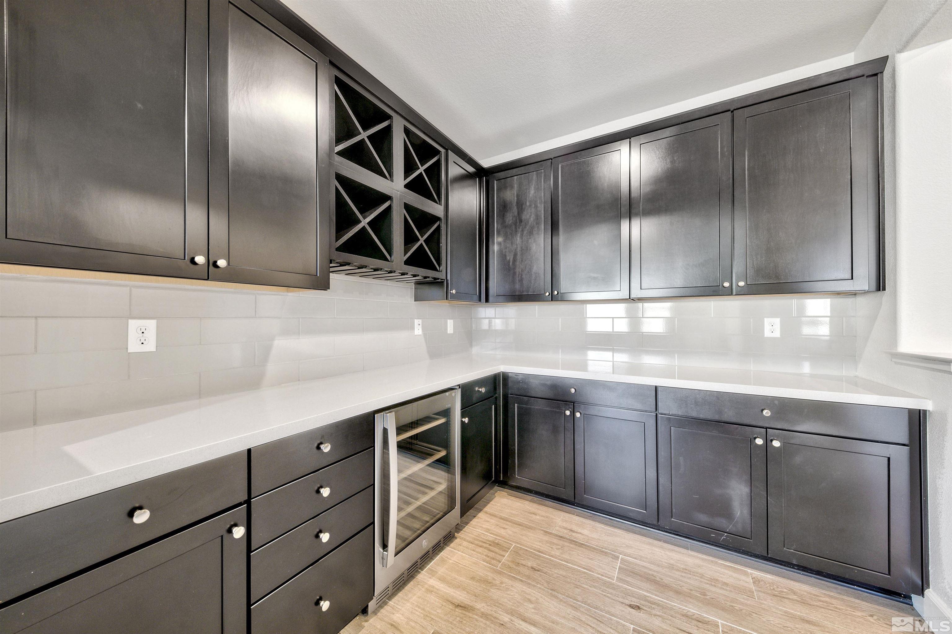 4505 High Pointe Drive Reno, NV 89521 - Photo 17 of 30 a kitchen with stainless steel appliances granite countertop a sink and cabinets