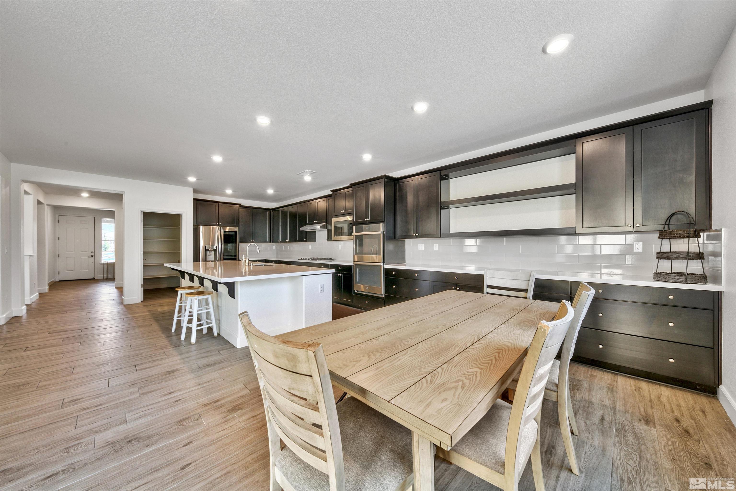 4505 High Pointe Drive Reno, NV 89521 - Photo 19 of 30 a kitchen with a table and chairs in it