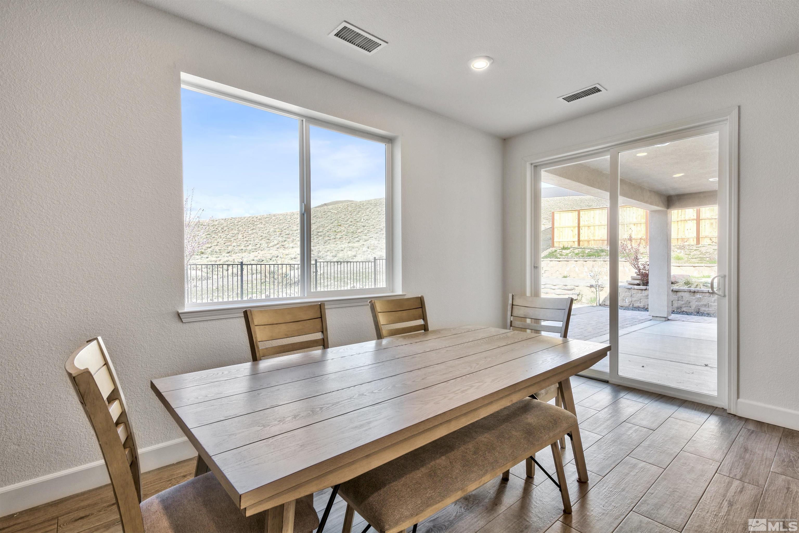 4505 High Pointe Drive Reno, NV 89521 - Photo 20 of 30 a view of a dining room with furniture and wooden floor
