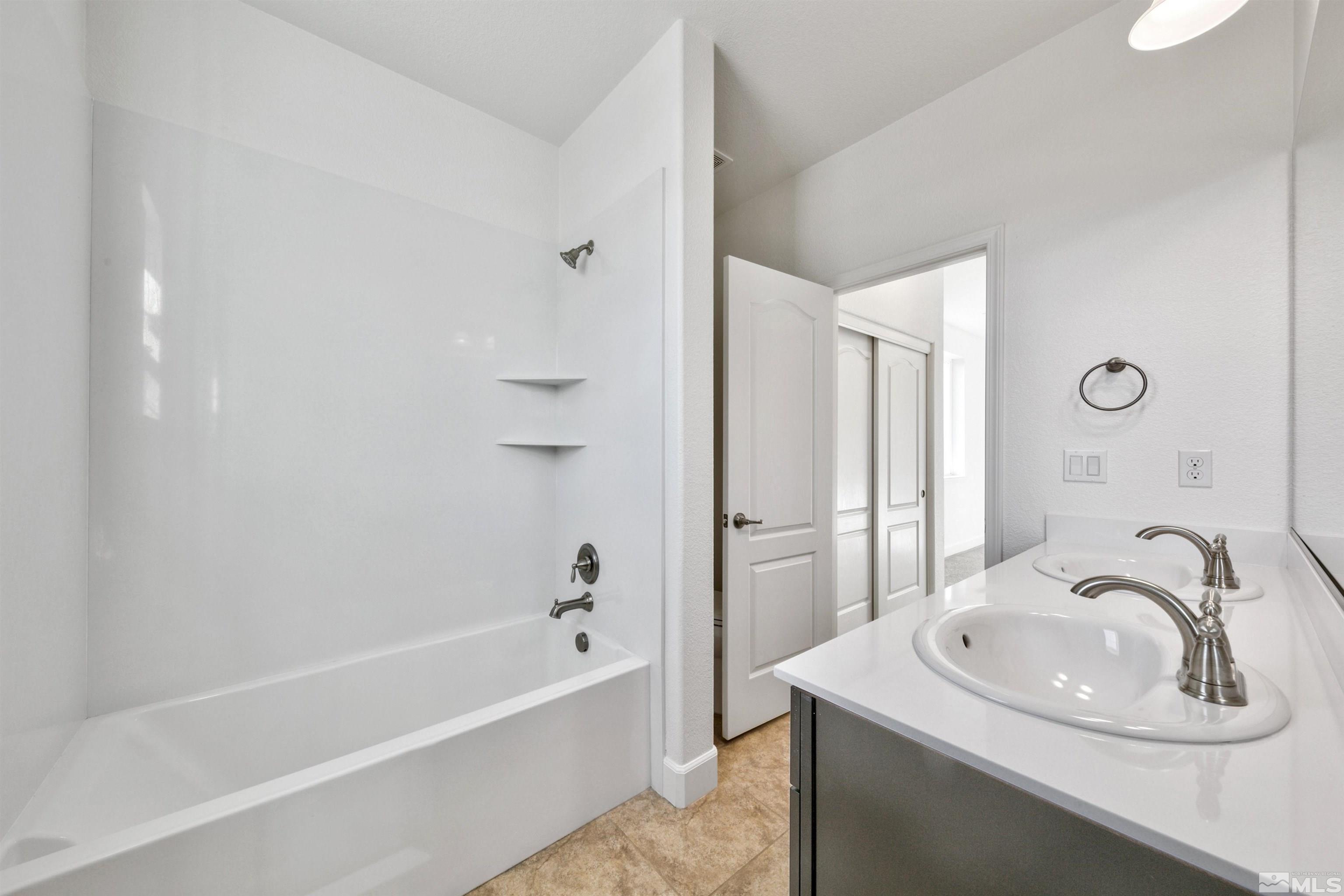 4505 High Pointe Drive Reno, NV 89521 - Photo 29 of 30 a bathroom with a sink a bathtub and a shower