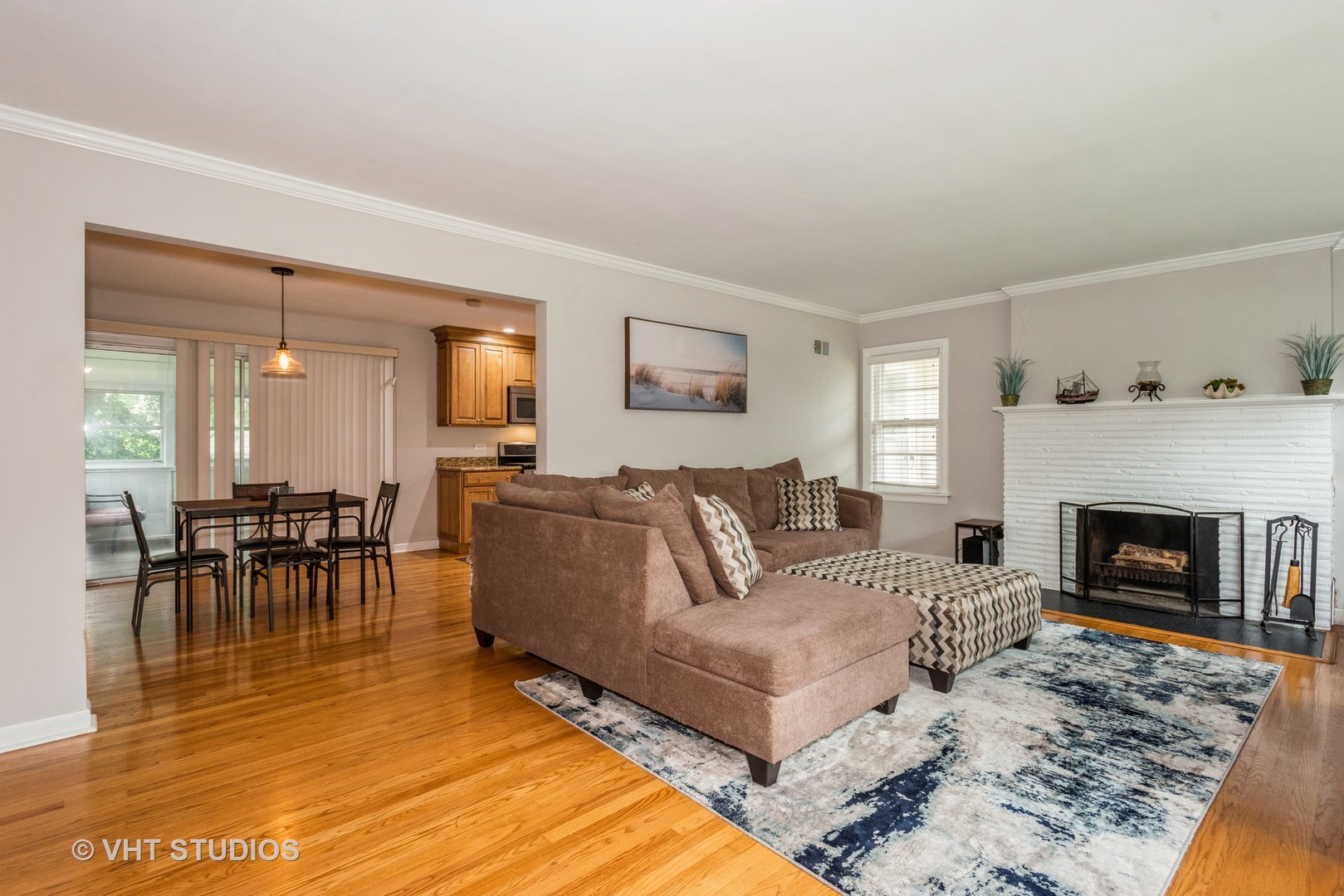 1217 South Naperville Road Wheaton, IL 60189 - Photo 8 of 13 a living room with furniture and a fireplace