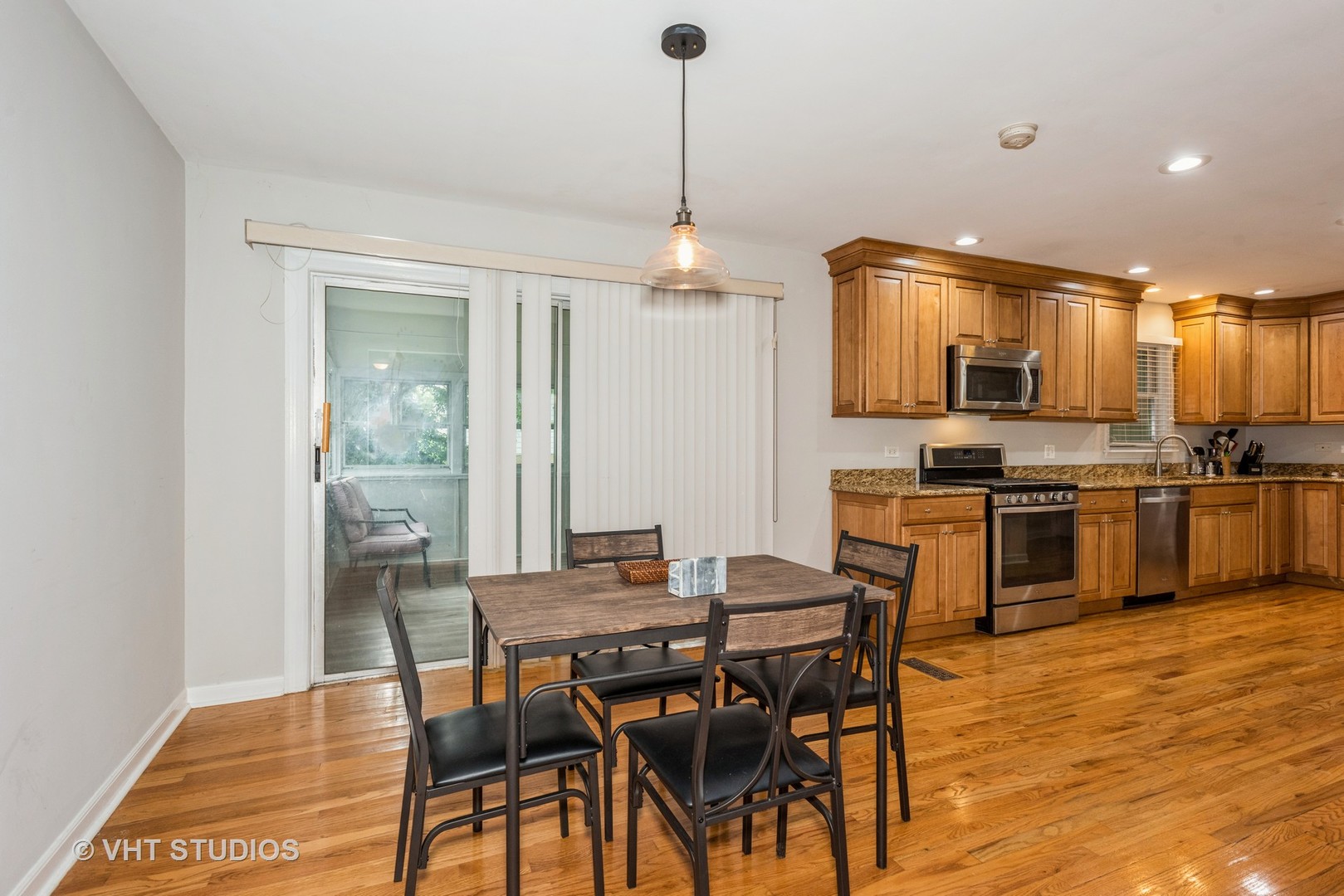 1217 South Naperville Road Wheaton, IL 60189 - Photo 9 of 13 a view of a dining room with furniture kitchen and wooden floor