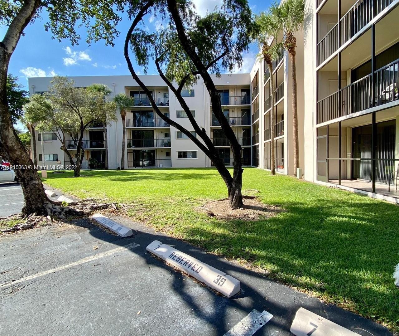 8650 Southwest 133rd Avenue Road, Unit 417 Miami, FL 33183 - Photo 1 of 14 a view of a house with a swimming pool