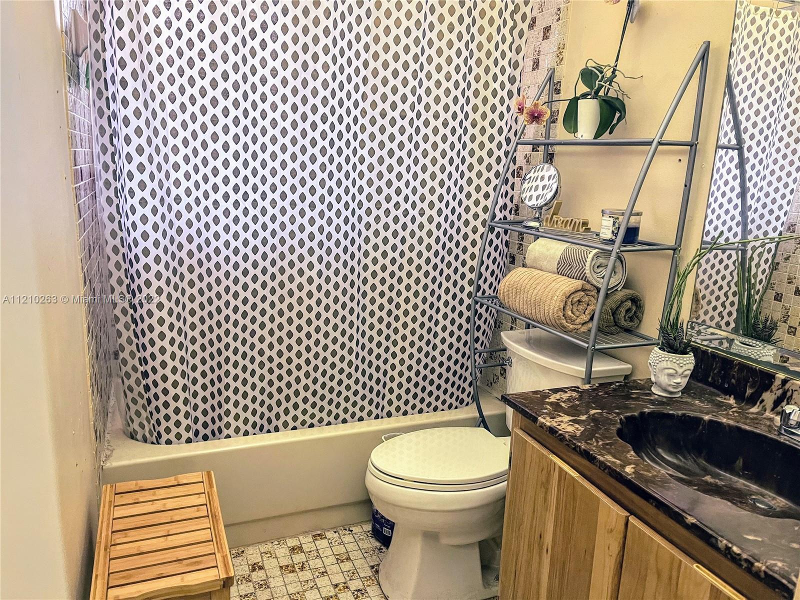 8650 Southwest 133rd Avenue Road, Unit 417 Miami, FL 33183 - Photo 6 of 14 a bathroom with a toilet and a sink