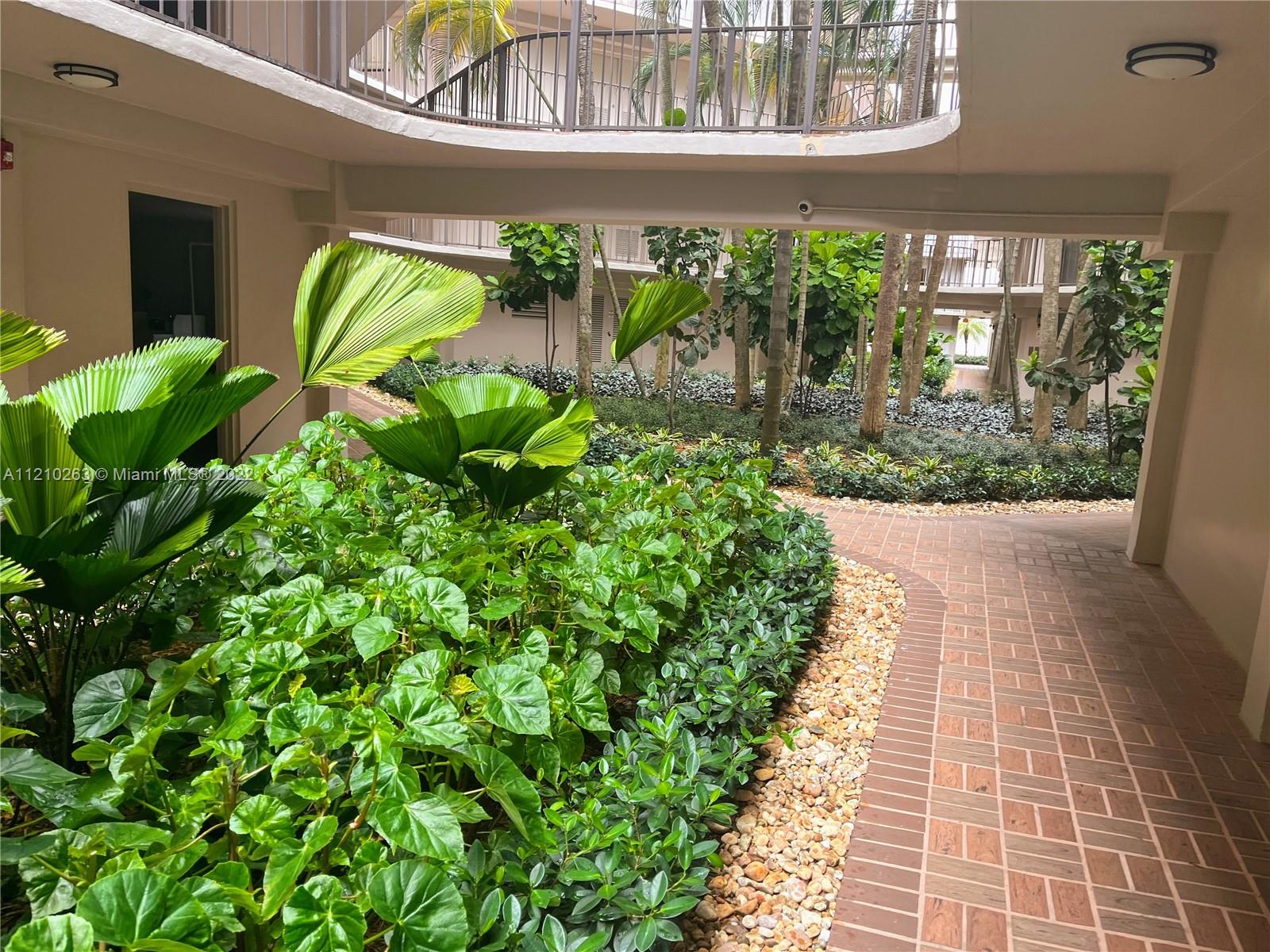 8650 Southwest 133rd Avenue Road, Unit 417 Miami, FL 33183 - Photo 10 of 14 a view of a back yard of the house