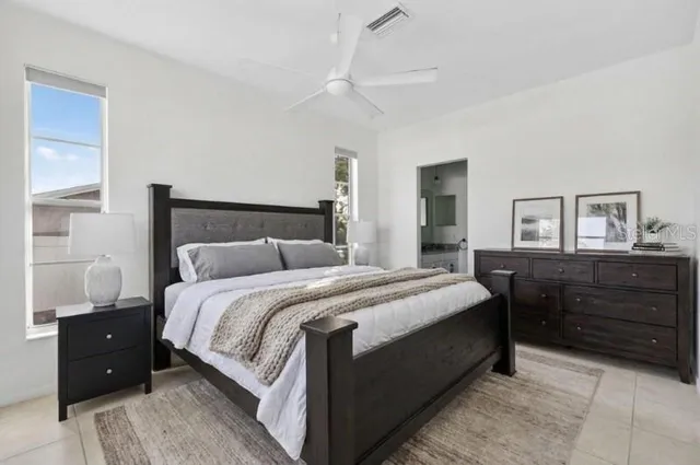 a bedroom with a bed and a dresser