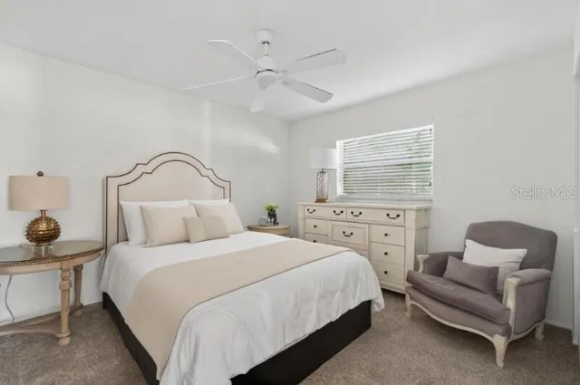 a bedroom with a bed and a couch