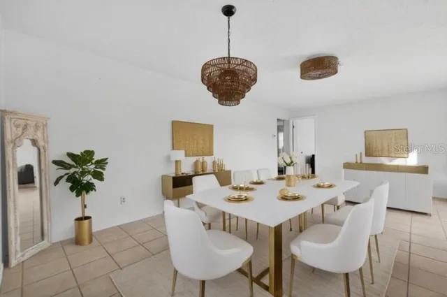 a dining room with furniture and window